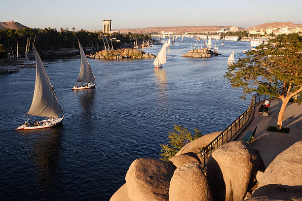 Traditional boats sailing on the Nile river in Aswan, Egypt.     You'll find whatever else you need in this lightbox: Egypt